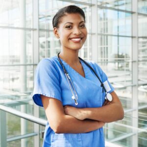 A Nurse Practitioner crossing her arms and smiling 