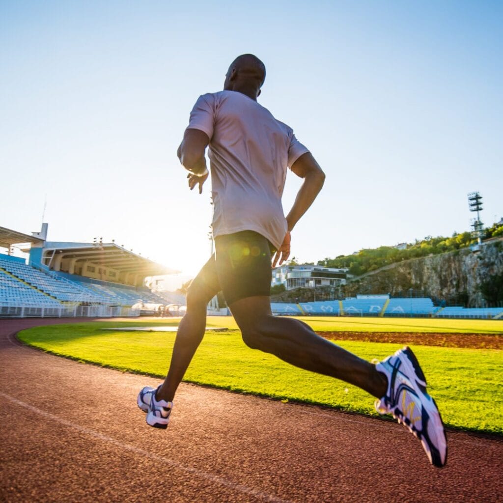 Someone running on an outdoor track