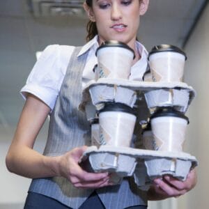 An intern holding coffee