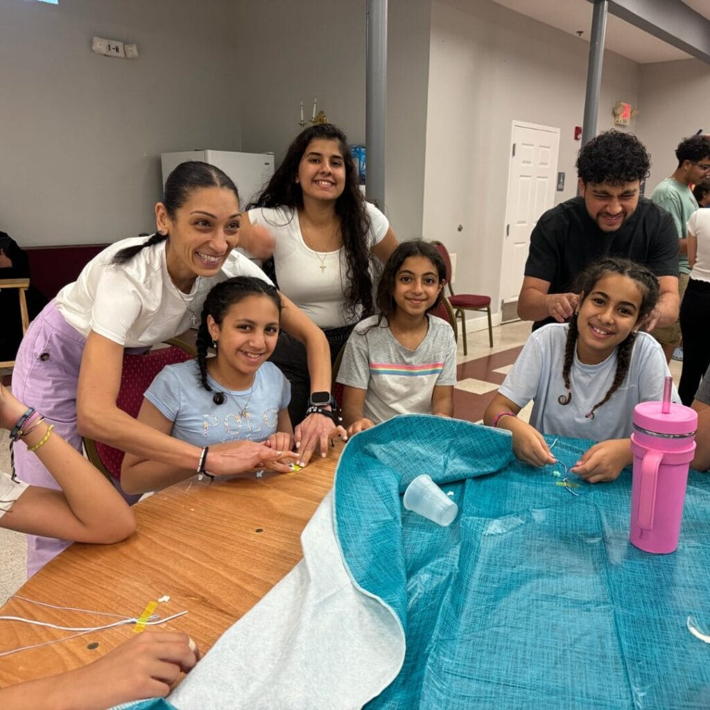 Dr. Christine Rizkalla with kids during one of her volunteer dentistry trips