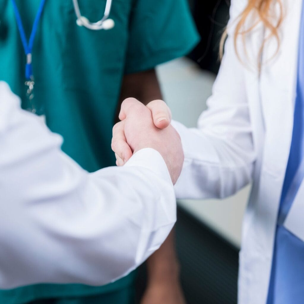 Two doctors shaking hands